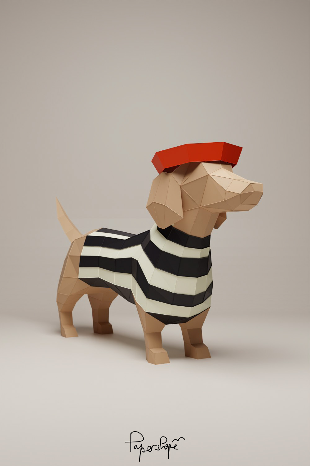 Papiermodell Dackel „Colette“ mit schwarz-weiß gestreiftem Papierpulli und rotem Béret. Stehend auf hellem Untergrund, von schräg vorn links fotografiert.