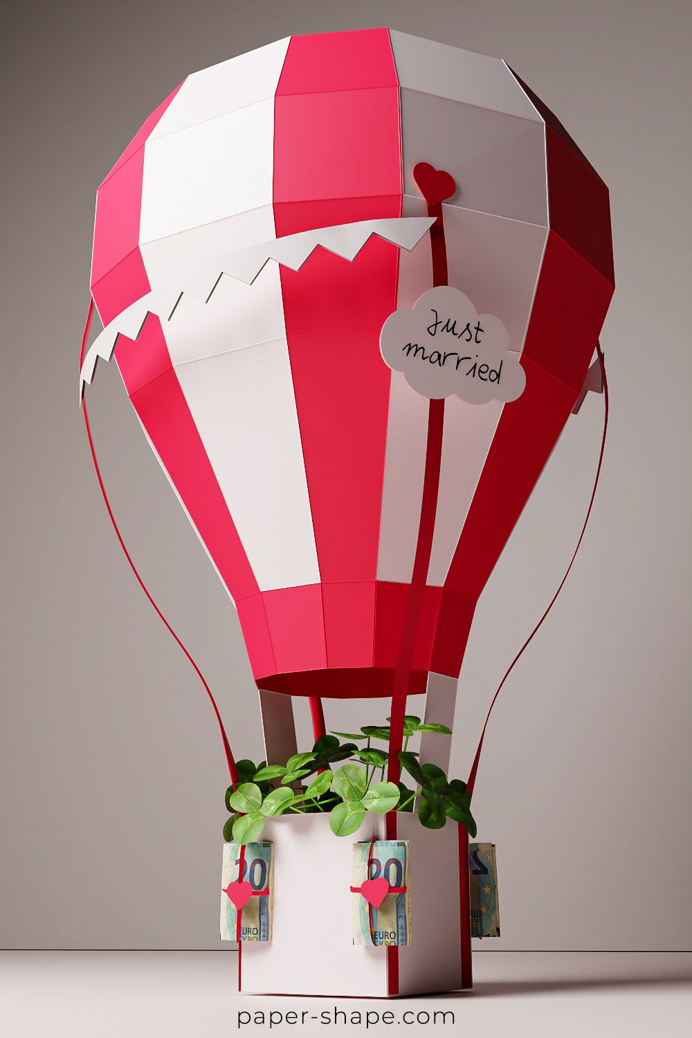 Hot air balloon in red and pearl white with banknotes as money bags 