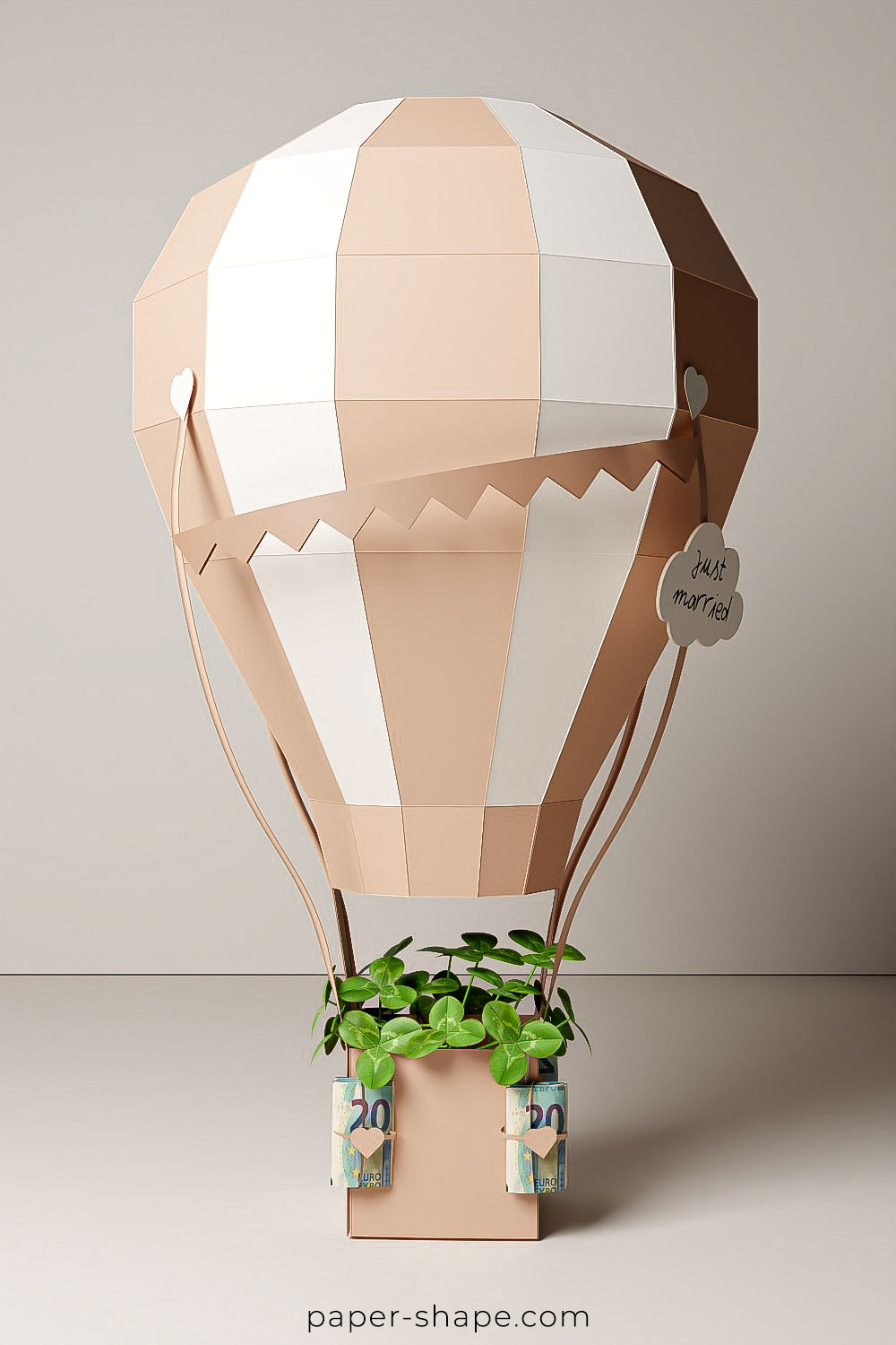 Hot air balloon in beige tones with banknotes as money bags 